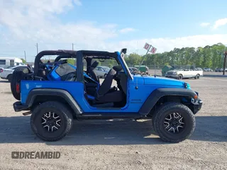 2015 Jeep Wrangler Sport z VIN 1C4AJWAG8FL550859, wystawiony jako IAAI lot #42154946 z przebiegiem 143 658 mil mil oraz . Historia ofert i sprzedaży dostępna na DreamBid. Obrazek 14.