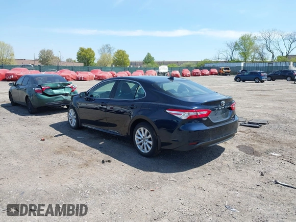2019 Toyota Camry LE with VIN 4T1B11HK6KU276644, listed as a IAAI auction lot 42037249 with 23,677 mi miles and . Bid and sale history available at DreamBid. Image 3.