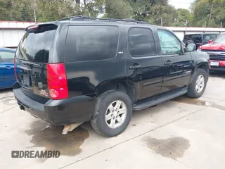2014 GMC Yukon SLT with VIN 1GKS1CE07ER229525, listed as a IAAI auction lot 40260080 with 180,043 mi miles. Bid and sale history available at carsss.com. Image 4.