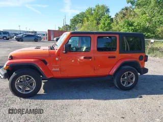 2018 Jeep Wrangler Unlimited Sahara with VIN 1C4HJXEG3JW323634, listed as a IAAI auction lot 41853471 with 126,531 mi miles. Bid and sale history available at carsss.com. Image 14.