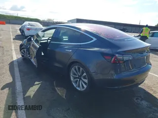 2018 Tesla Model 3 Long Range Battery with VIN 5YJ3E1EA4JF006036, listed as a IAAI auction lot 41934680 with 115,649 mi miles and . Bid and sale history available at DreamBid. Image 3.