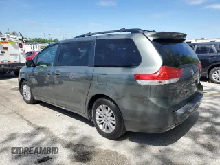 2014 Toyota Sienna XLE with VIN 5TDYK3DC1ES453924, listed as a Copart auction lot 56148565 with 198,185 mi miles and Clean title. Bid and sale history available at DreamBid. Image 2.