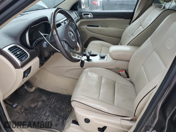 2014 Jeep Grand Cherokee Overland with VIN 1C4RJFCG9EC572237, listed as a Copart auction lot 53864865 with 90,657 mi miles and Salvage Title. Bid and sale history available at DreamBid. Image 7.