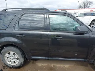 2011 Mercury Mariner with VIN 4M2CN8B7XBKJ01717, listed as a IAAI auction lot 42030587 with 115,766 mi miles. Bid and sale history available at carsss.com. Image 13.