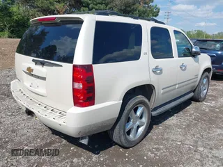 2013 Chevrolet Tahoe LTZ with VIN 1GNSKCE07DR326996, listed as a IAAI auction lot 42203073 with 147,067 mi miles and . Bid and sale history available at DreamBid. Image 4.