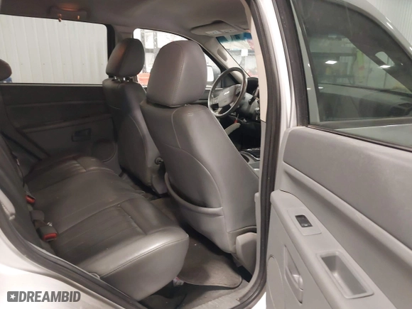 2007 Jeep Grand Cherokee Laredo with VIN 1J8GR48K57C687365, listed as a IAAI auction lot 42038456 with 162,343 mi miles. Bid and sale history available at carsss.com. Image 8.