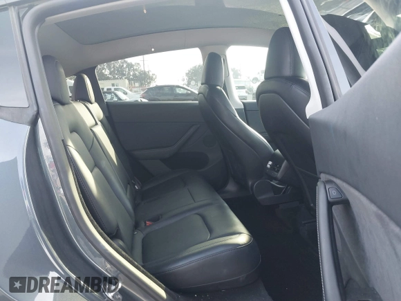 2023 Tesla Model Y Long Range with VIN 7SAYGDEE7PA196038, listed as a IAAI auction lot 41459601 with 16,489 mi miles and . Bid and sale history available at DreamBid. Image 8.