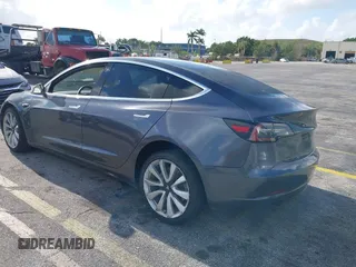 2020 Tesla Model 3 Standard Range Plus with VIN 5YJ3E1EA0LF744046, listed as a IAAI auction lot 41939894 with 102,576 mi miles. Bid and sale history available at carsss.com. Image 3.