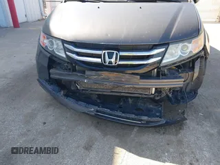 2014 Honda Odyssey Touring with VIN 5FNRL5H97EB101169, listed as a IAAI auction lot 41869233 with 142,147 mi miles and . Bid and sale history available at DreamBid. Image 6.