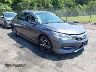 2016 Honda Accord Touring with VIN 1HGCR3F94GA009459, listed as a IAAI auction lot 42597128 with 182,977 mi miles and . Bid and sale history available at DreamBid. Image 1.