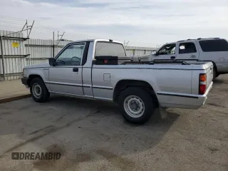 1988 Mitsubishi Mighty Max z VIN JA7FL24D2JP013297, wystawiony jako Copart lot #79533724 z przebiegiem 117 397 mil mil oraz Tytuł czysty. Historia ofert i sprzedaży dostępna na DreamBid. Obrazek 2.