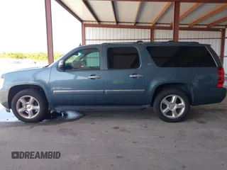 2009 Chevrolet Suburban LTZ with VIN 1GNFC36J29R293712, listed as a IAAI auction lot 42577800 with 202,593 mi miles and . Bid and sale history available at DreamBid. Image 14.