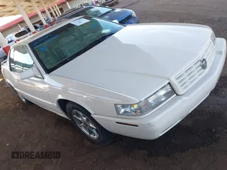 2002 Cadillac Eldorado z VIN 1G6EC12922B106670, wystawiony jako IAAI lot #41648782 z przebiegiem 174 320 mil mil oraz . Historia ofert i sprzedaży dostępna na DreamBid. Obrazek 1.