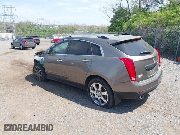2011 Cadillac SRX Premium Collection with VIN 3GYFNFEY7BS519548, listed as a IAAI auction lot 42097305 with 124,083 mi miles and . Bid and sale history available at DreamBid. Image 3.