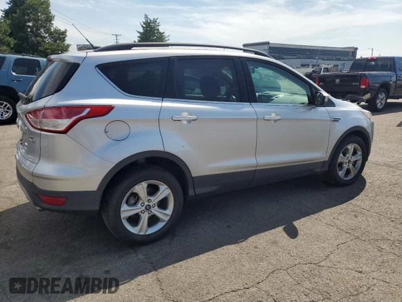 2014 Ford Escape SE with VIN 1FMCU9GX3EUB19987, listed as a Copart auction lot 64042695 with 96,775 mi miles and Salvage title. Bid and sale history available at DreamBid. Image 3.