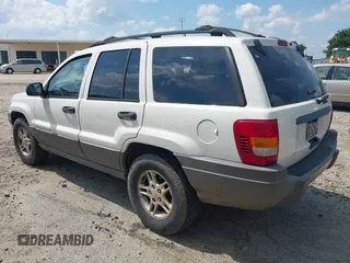2003 Jeep Grand Cherokee Laredo z VIN 1J4GX48S33C519404, wystawiony jako IAAI lot #42164364 z przebiegiem 174 627 mil mil oraz . Historia ofert i sprzedaży dostępna na DreamBid. Obrazek 3.