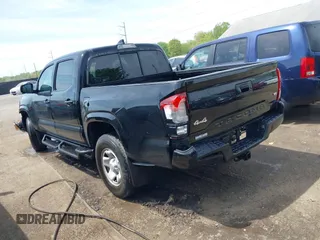 2022 Toyota Tacoma SR with VIN 3TYCZ5AN0NT074683, listed as a IAAI auction lot 42117875 with 51,112 mi miles and . Bid and sale history available at DreamBid. Image 3.