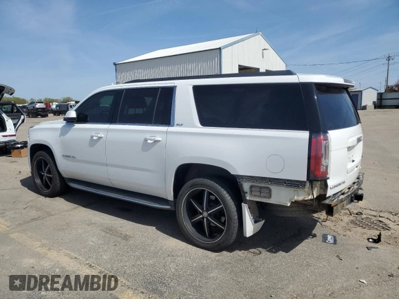 2016 GMC Yukon XL SLT with VIN 1GKS2GKC6GR228033, listed as a Copart auction lot 52450055 with 135,476 mi miles and Salvage Title. Bid and sale history available at DreamBid. Image 2.
