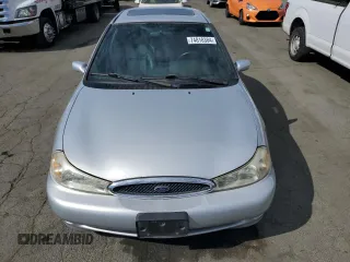 1999 Ford Contour z VIN 1FAFP68G9XK142510, wystawiony jako Copart lot #74818384 z przebiegiem 65 885 mil mil oraz Tytuł czysty. Historia ofert i sprzedaży dostępna na DreamBid. Obrazek 5.