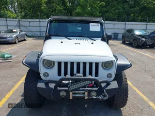 2015 Jeep Wrangler Unlimited Rubicon z VIN 1C4BJWFGXFL755810, wystawiony jako IAAI lot #42495531 z przebiegiem 109 668 mil mil oraz . Historia ofert i sprzedaży dostępna na DreamBid. Obrazek 12.