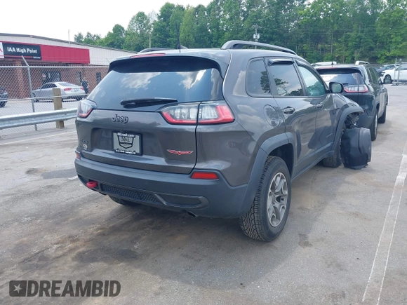 2020 Jeep Cherokee Trailhawk with VIN 1C4PJMBX5LD530720, listed as a IAAI auction lot 42404948 with 99,606 mi miles and . Bid and sale history available at DreamBid. Image 4.