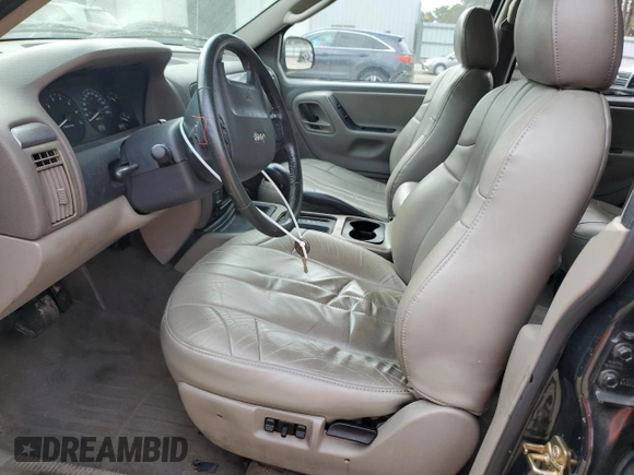 2003 Jeep Grand Cherokee Laredo with VIN 1J4GX48S43C609354, listed as a Copart auction lot 43924595 with 212,949 mi miles and Salvage Title. Bid and sale history available at carsss.com. Image 7.