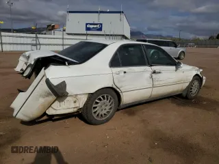 1998 Acura RL Premium z VIN JH4KA9657WC008762, wystawiony jako Copart lot #52979915 z przebiegiem 144 954 mil mil oraz Szkody całkowita. Historia ofert i sprzedaży dostępna na DreamBid. Obrazek 3.