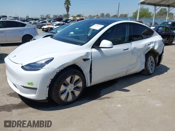 2023 Tesla Model Y Long Range z VIN 7SAYGDEE5PA104635, wystawiony jako IAAI lot #41989014 z przebiegiem 15 347 mil mil oraz . Historia ofert i sprzedaży dostępna na DreamBid. Obrazek 2.