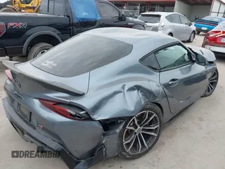 2021 Toyota Supra 2.0 with VIN WZ1DB2C0XMW038679, listed as a IAAI auction lot 42407988 with 76,316 mi miles and . Bid and sale history available at DreamBid. Image 4.