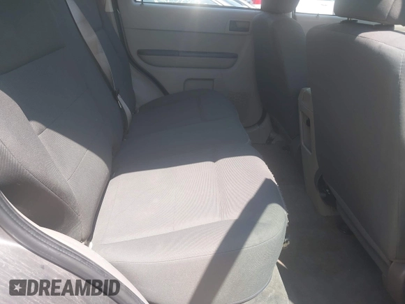 2009 Ford Escape XLS z VIN 1FMCU02729KC33600, wystawiony jako IAAI lot #42469557 z przebiegiem 185 605 mil mil oraz . Historia ofert i sprzedaży dostępna na DreamBid. Obrazek 8.