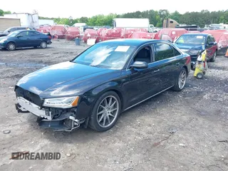 2015 Audi A8 3.0T with VIN WAU3GAFD6FN008993, listed as a IAAI auction lot 42239421 with 125,587 mi miles and . Bid and sale history available at DreamBid. Image 2.