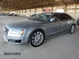 2012 Audi A8 с VIN WAURVAFD0CN028037, выставлен на аукционе Copart как лот 61004815 с пробегом 97 424 миль миль и Списание • Salvage title. История ставок и продаж доступна на DreamBid. Изображение 1.