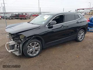 2022 BMW X2 xDrive28i with VIN WBXYJ1C01N5U20171, listed as a IAAI auction lot 41284932 with 64,256 mi miles. Bid and sale history available at carsss.com. Image 2.