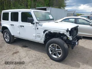 2020 Jeep Wrangler Unlimited Sahara with VIN 1C4HJXEN3LW136198, listed as a IAAI auction lot 42221250 with 61,424 mi miles and . Bid and sale history available at DreamBid. Image 1.