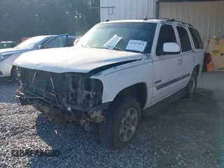 2005 GMC Yukon SLE z VIN 1GKEC13T25J140176, wystawiony jako IAAI lot #42267014 z przebiegiem Nie podano mil oraz . Historia ofert i sprzedaży dostępna na DreamBid. Obrazek 2.