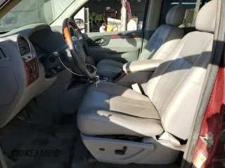 2006 GMC Envoy Denali with VIN 1GKES63M762237958, listed as a Copart auction lot 76999574 with 180,294 mi miles and Clean Title. Bid and sale history available at carsss.com. Image 7.