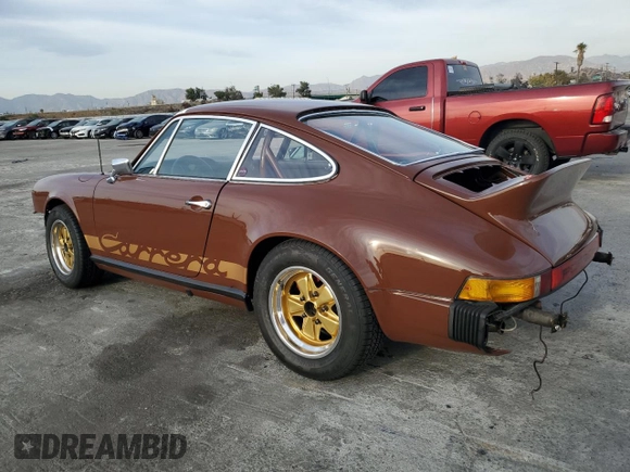 1975 Porsche 911 with VIN 9115201599, listed as a Copart auction lot 79267654 with 69,699 mi miles and Salvage title. Bid and sale history available at DreamBid. Image 2.