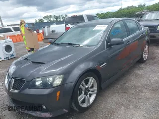 2009 Pontiac G8 z VIN 6G2ER57789L169343, wystawiony jako IAAI lot #42391701 z przebiegiem 293 400 mil mil oraz . Historia ofert i sprzedaży dostępna na DreamBid. Obrazek 2.