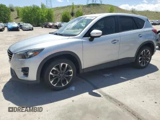 2016 Mazda CX-5 Grand Touring with VIN JM3KE4DY3G0821306, listed as a Copart auction lot 57178395 with 106,016 mi miles and Clean Title. Bid and sale history available at DreamBid. Image 1.