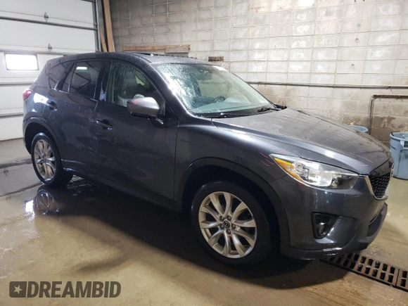 2015 Mazda CX-5 Grand Touring with VIN JM3KE4DY1F0454713, listed as a Copart auction lot 48548285 with 132,454 mi miles and Salvage Title. Bid and sale history available at DreamBid. Image 4.