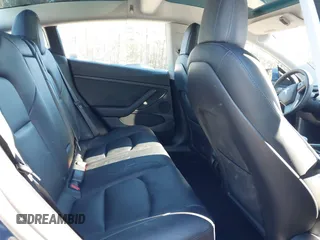 2022 Tesla Model 3 Long Range with VIN 5YJ3E1EB1NF257059, listed as a IAAI auction lot 41329318 with 30,652 mi miles and . Bid and sale history available at DreamBid. Image 8.
