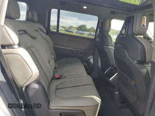 2023 Rivian R1S Adventure z VIN 7PDSGABA3PN024458, wystawiony jako Copart lot #74087714 z przebiegiem 3 505 mil mil oraz Nie do naprawy • Non repairable. Historia ofert i sprzedaży dostępna na DreamBid. Obrazek 11.