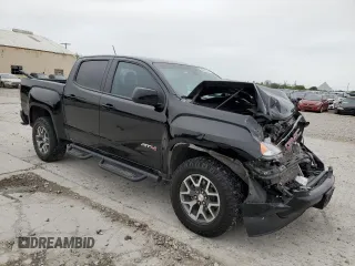 2022 GMC Canyon 4WD AT4 w/Leather with VIN 1GTG6FEN2N1294071, listed as a Copart auction lot 84652954 with 53,076 mi miles and Salvage Title. Bid and sale history available at carsss.com. Image 4.