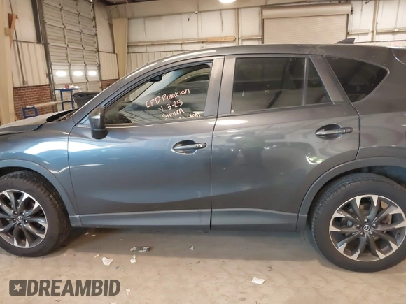 2016 Mazda CX-5 Grand Touring with VIN JM3KE2DYXG0846787, listed as a IAAI auction lot 41346364 with 113,553 mi miles. Bid and sale history available at carsss.com. Image 14.