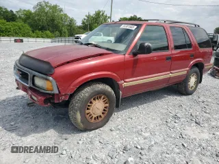 1997 GMC Jimmy SLS z VIN 1GKDT13W8V2557270, wystawiony jako Copart lot #55381665 z przebiegiem 198 743 mil mil oraz Szkoda całkowita • Salvage title. Historia ofert i sprzedaży dostępna na DreamBid. Obrazek 1.