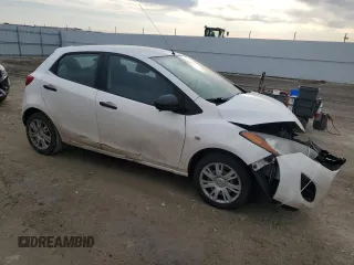 2012 Mazda 2 Sport with VIN JM1DE1KY8C0145089, listed as a Copart auction lot 52093925 with 211,282 mi miles and Salvage Title. Bid and sale history available at DreamBid. Image 4.