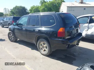2004 GMC Envoy SLE with VIN 1GKDS13S942294303, listed as a IAAI auction lot 41992547 with 196,444 mi miles. Bid and sale history available at carsss.com. Image 3.