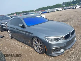 2018 BMW 5 Series M550i xDrive with VIN WBAJB9C55JB049983, listed as a IAAI auction lot 40107400 with 75,631 mi miles. Bid and sale history available at carsss.com. Image 1.