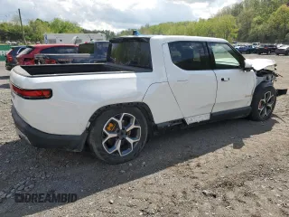 2022 Rivian R1T Adventure z VIN 7FCTGAAA8NN016263, wystawiony jako Copart lot #55668845 z przebiegiem 27 864 mil mil oraz Szkody całkowita. Historia ofert i sprzedaży dostępna na DreamBid. Obrazek 3.