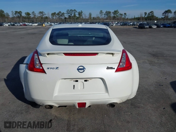 2013 Nissan 370Z z VIN JN1AZ4EH4DM380820, wystawiony jako IAAI lot #41547638 z przebiegiem 118 222 mil mil oraz . Historia ofert i sprzedaży dostępna na DreamBid. Obrazek 16.